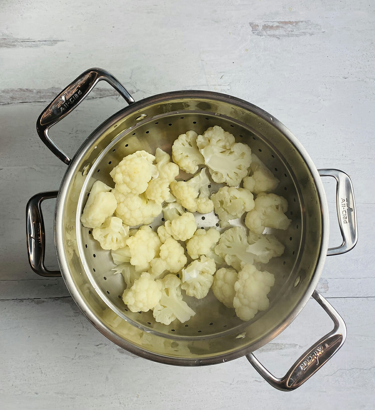 Steamed cauliflower in a steamer.