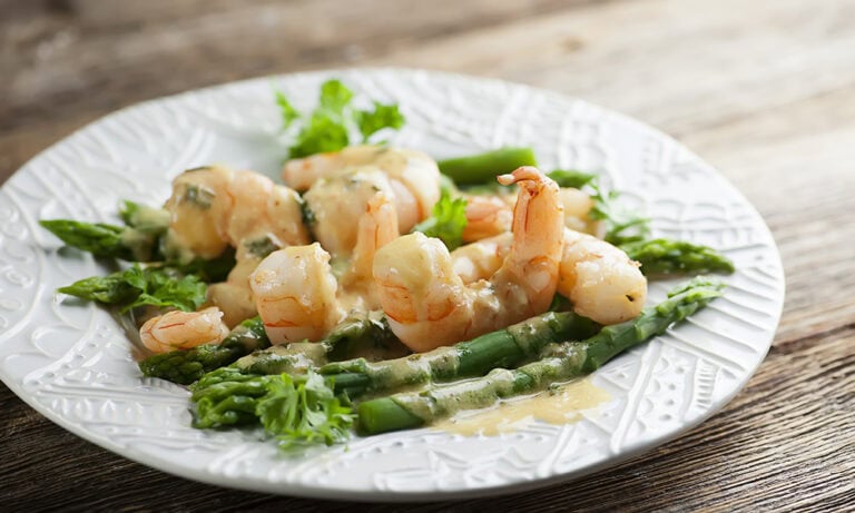 Mustard shrimp scampi on a plate.