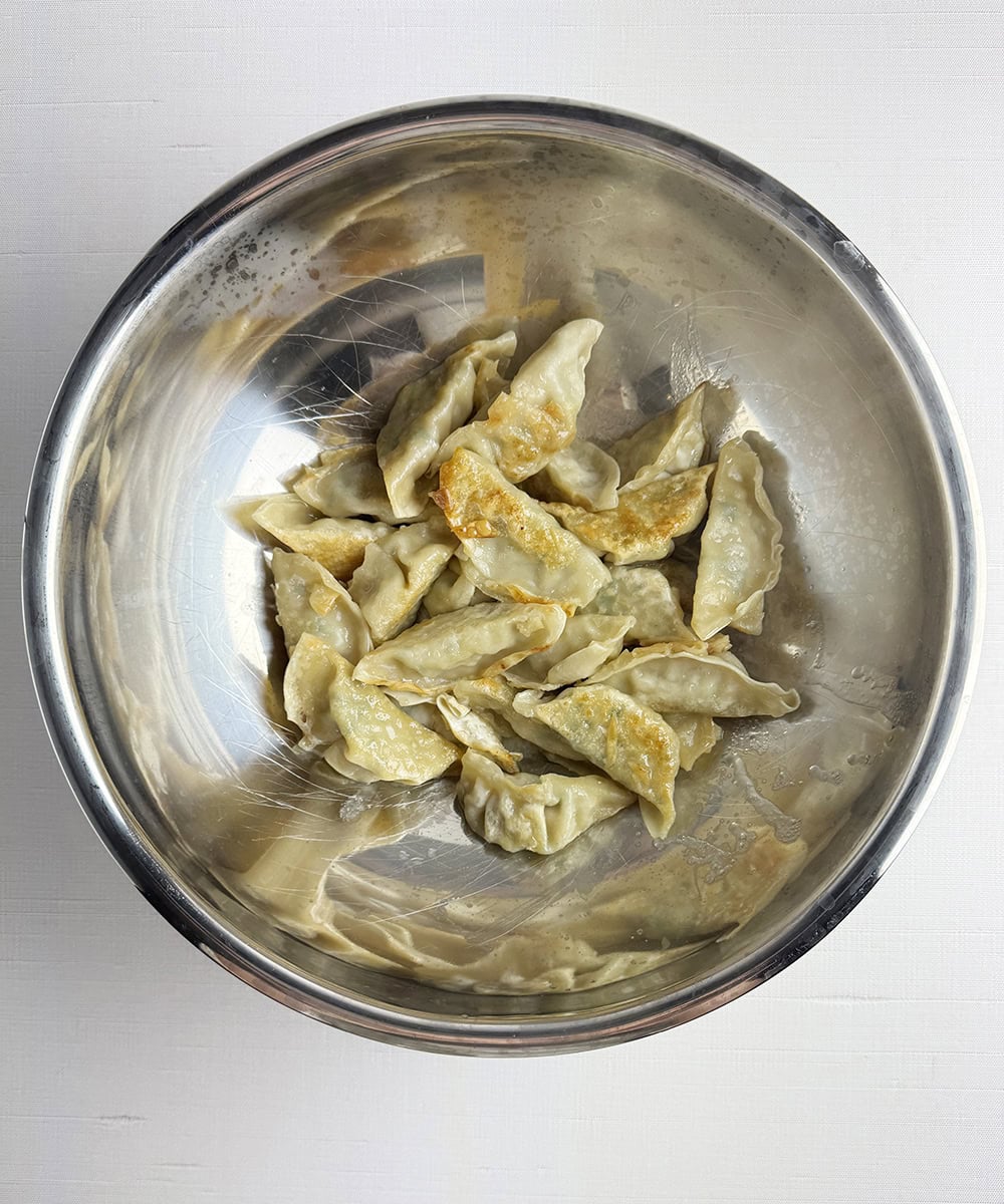 Cooked shrimp dumplings in a bowl.