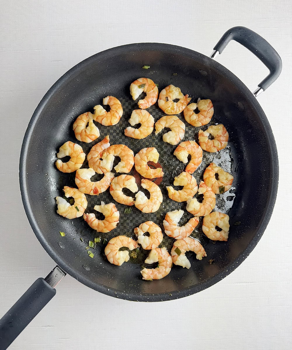 Shrimp cooked in a skillet.