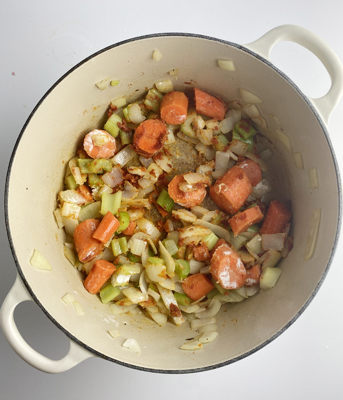 Sauteed vegetables in a Dutch oven.