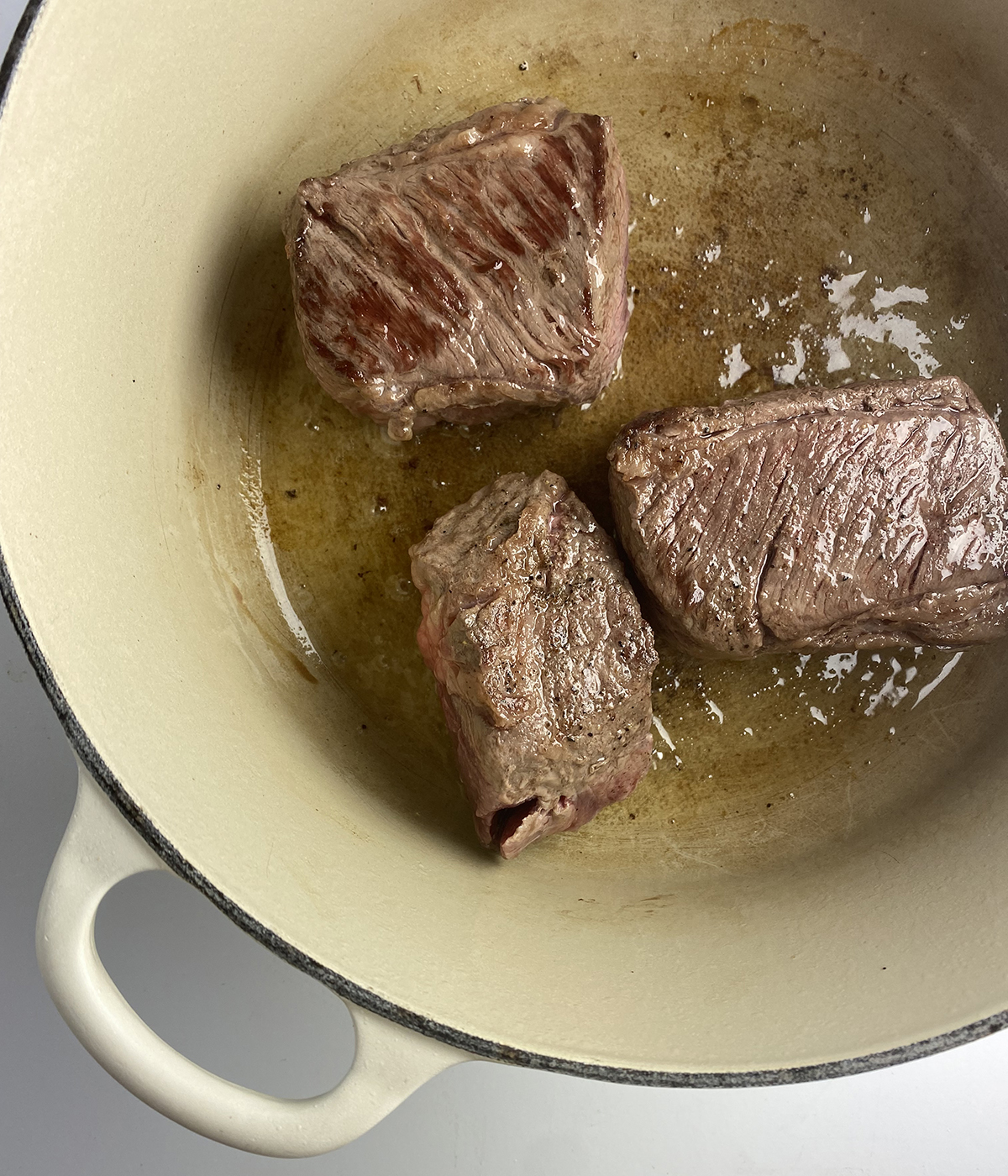 Seared short ribs in a Dutch Oven.