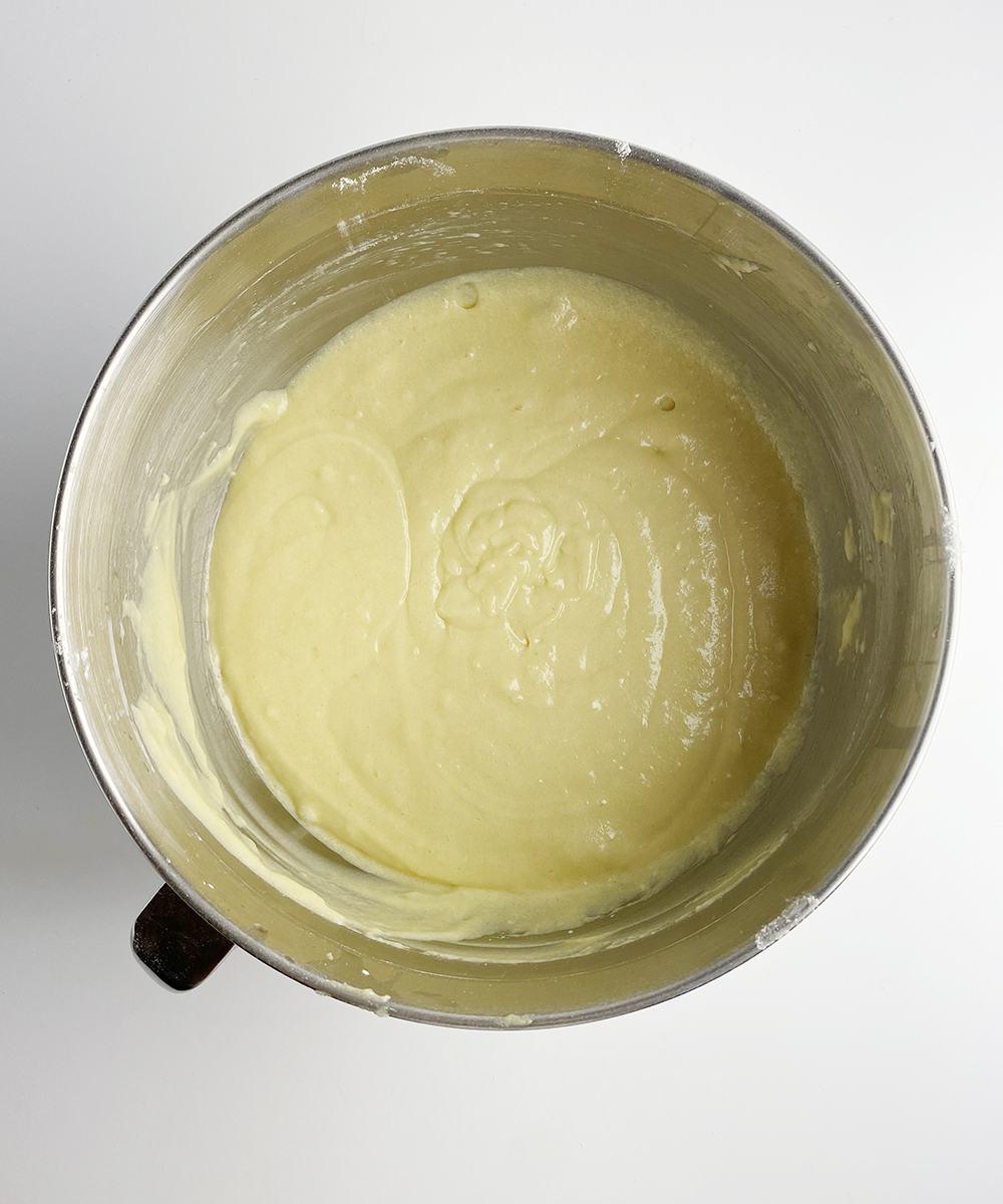 Orange juice crumb cake batter in a mixing bowl.