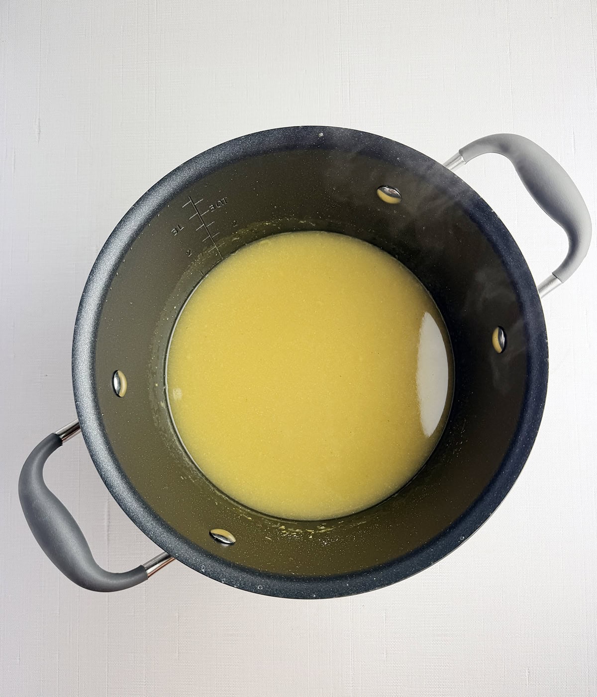 Polenta broth in a pot.