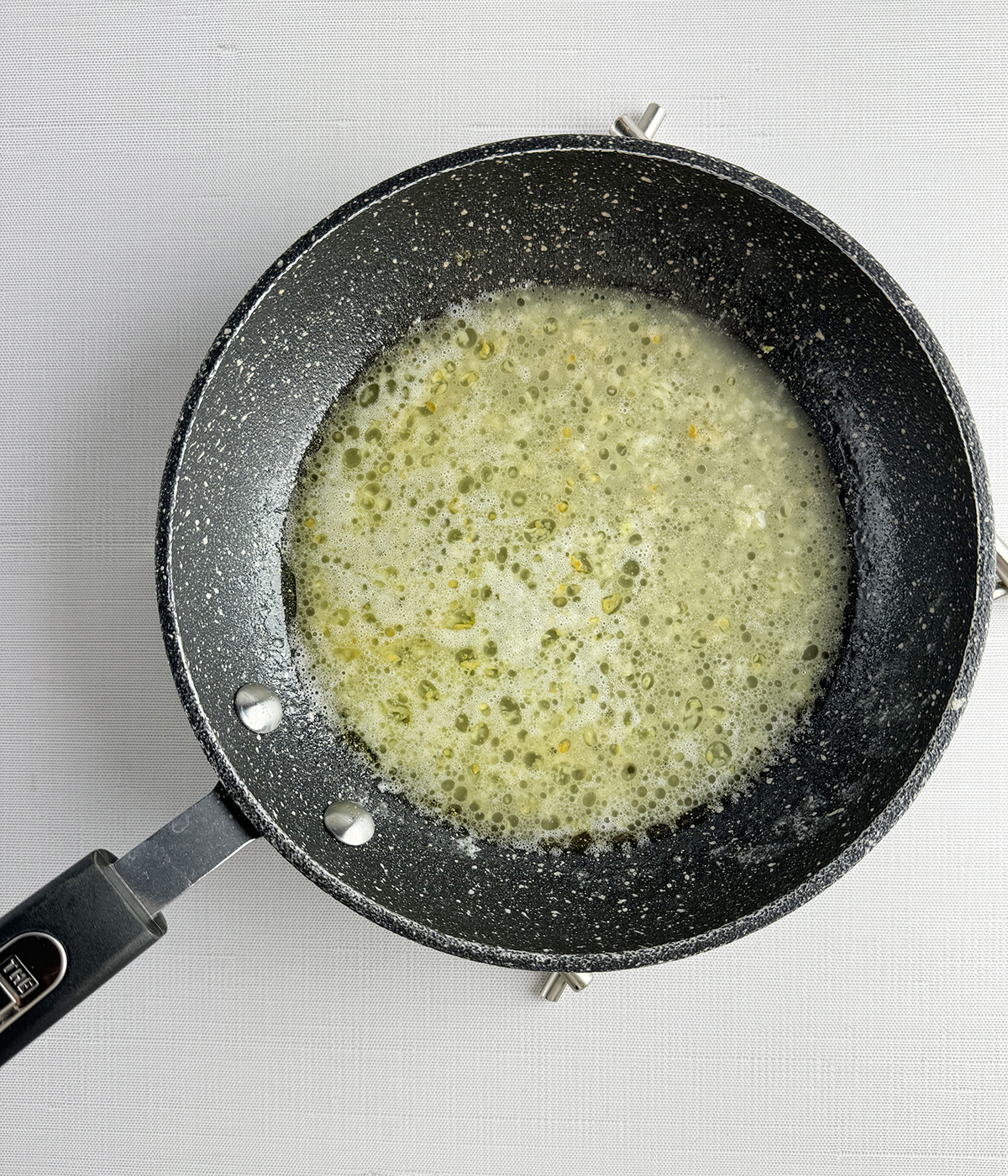 White wine mixture in a skillet.