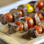 Steak skewers on a serving platter.
