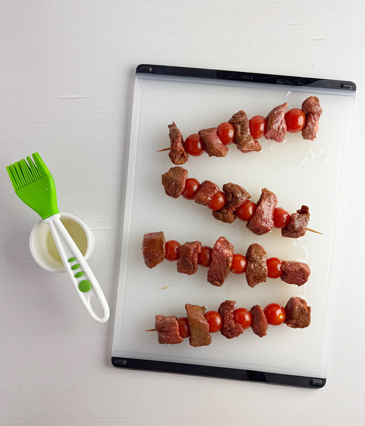 Steak skewers brushed with canola oil.