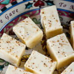 Eggnog fudge on a holiday plate.