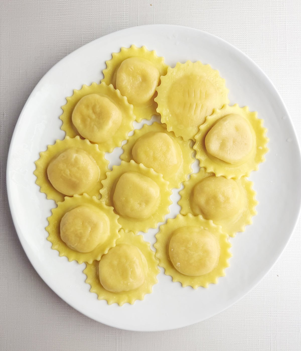 Cooked ravioli on a plate.