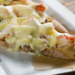 Lobster grilled cheese sandwich on a platter.
