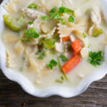 A bowl of creamy chicken noodle soup.