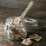 Deviled ham spread in a jar with a wooden server.
