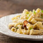 Sour cream and bacon pasta on a plate.