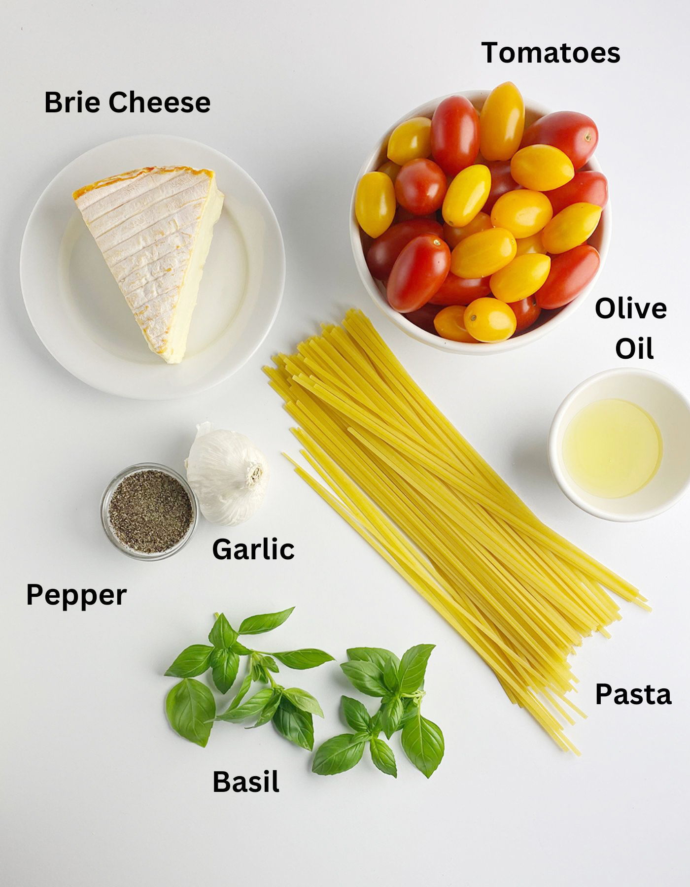 Ingredients needed for pasta with brie and tomatoes.