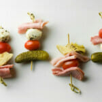 Antipasto skewers on a platter.