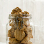 Hermit cookies in a glass cookie jar.