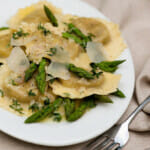 Ravioli with asparagus on a plate.