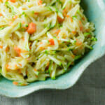 Cheesy vegetable orzo in a dish.