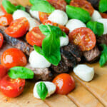 Steak Caprese on a cutting board.