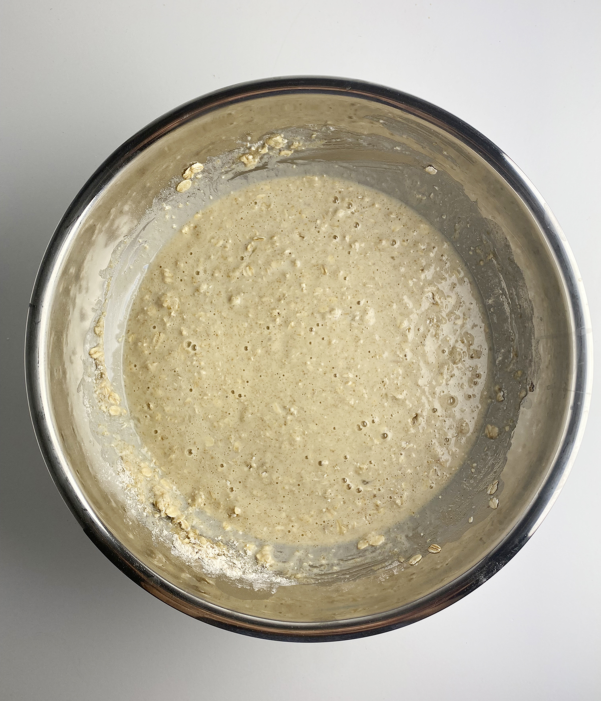 Cinnamon oat pancake batter in a bowl.