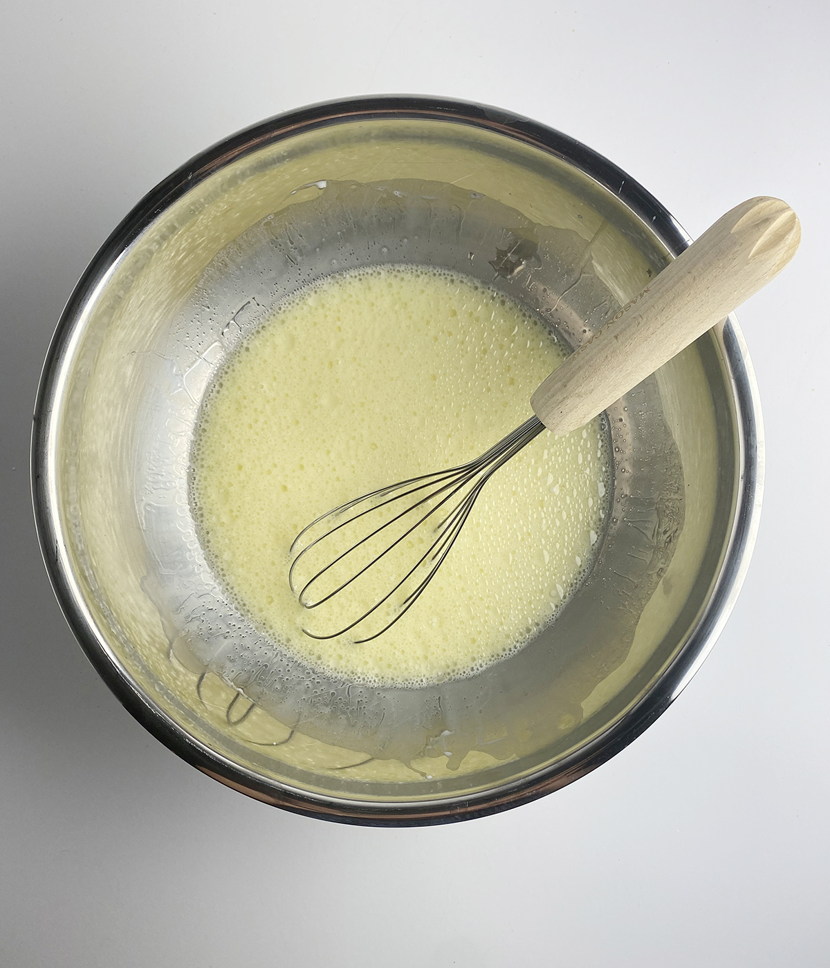 Milk and egg mixture in a bowl.