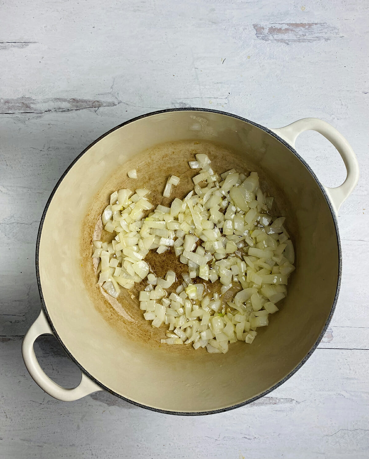 Sauteed onions in a Dutch oven.