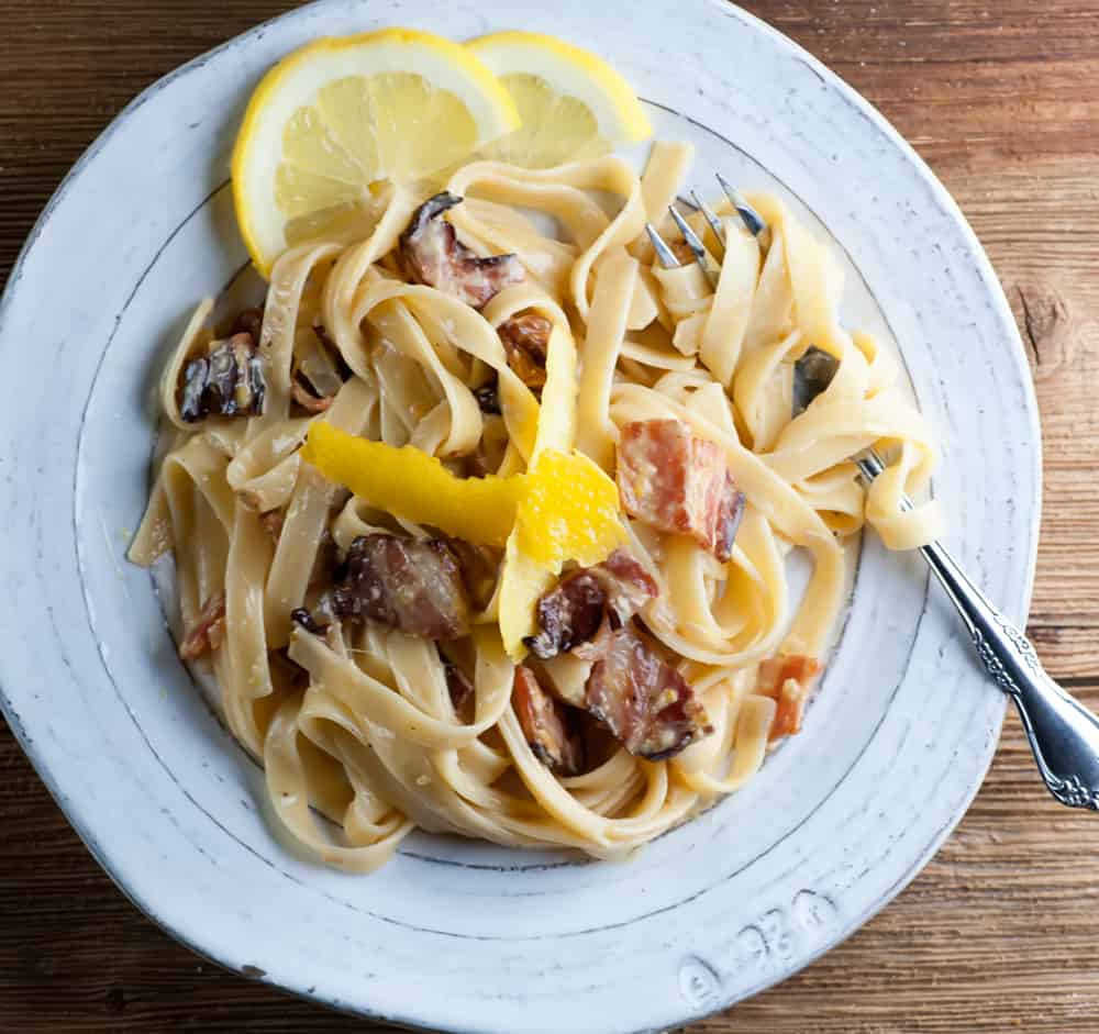 Lemon pasta carbonara on a plate.