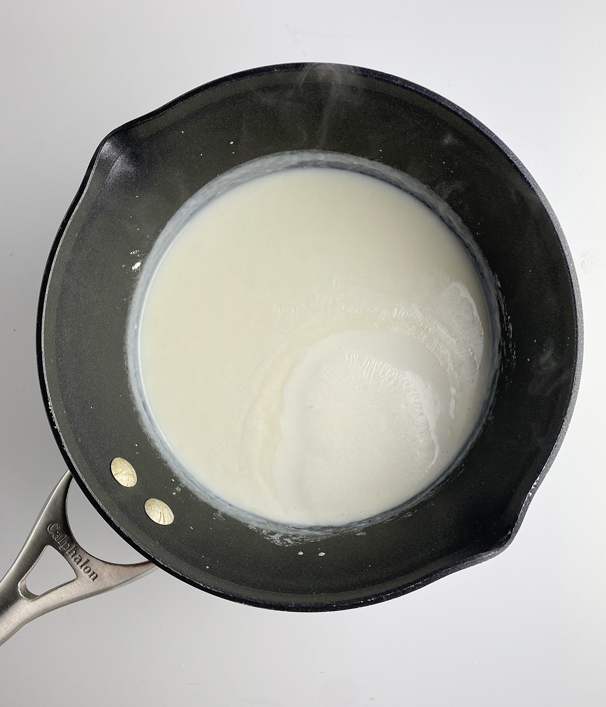 Cream sauce in a pot.