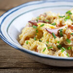 Lobster scrambled eggs in a bowl.