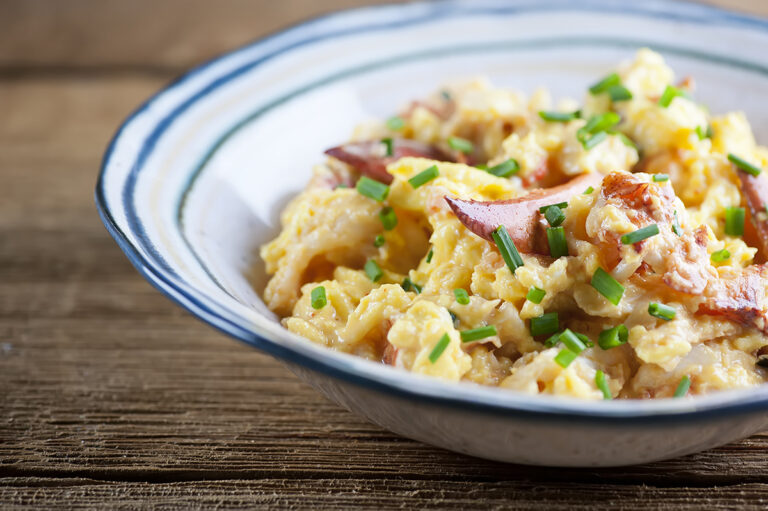Lobster scrambled eggs in a bowl.