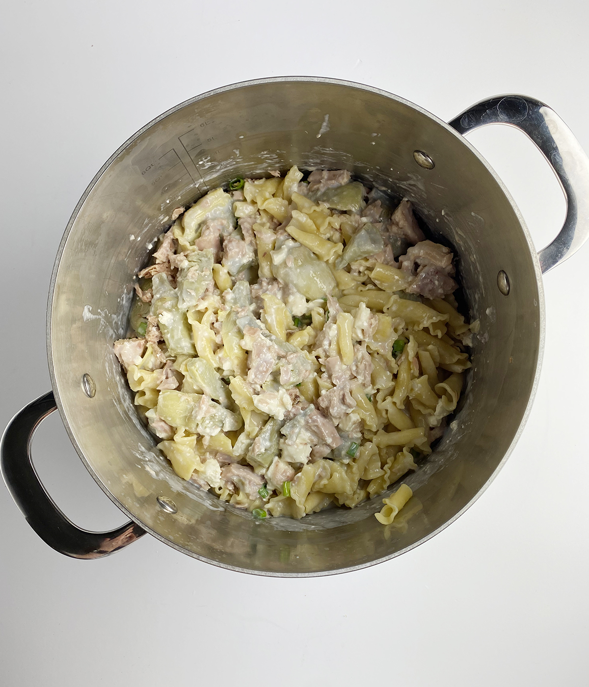 Mediterranean tuna casserole mixture in a pot.
