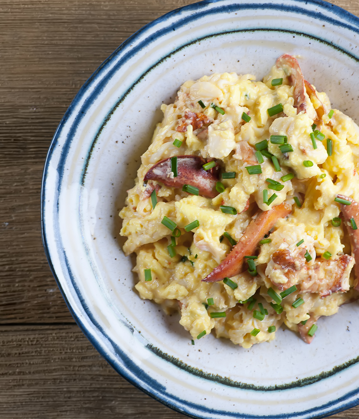 Scrambled eggs with lobster in a bowl.