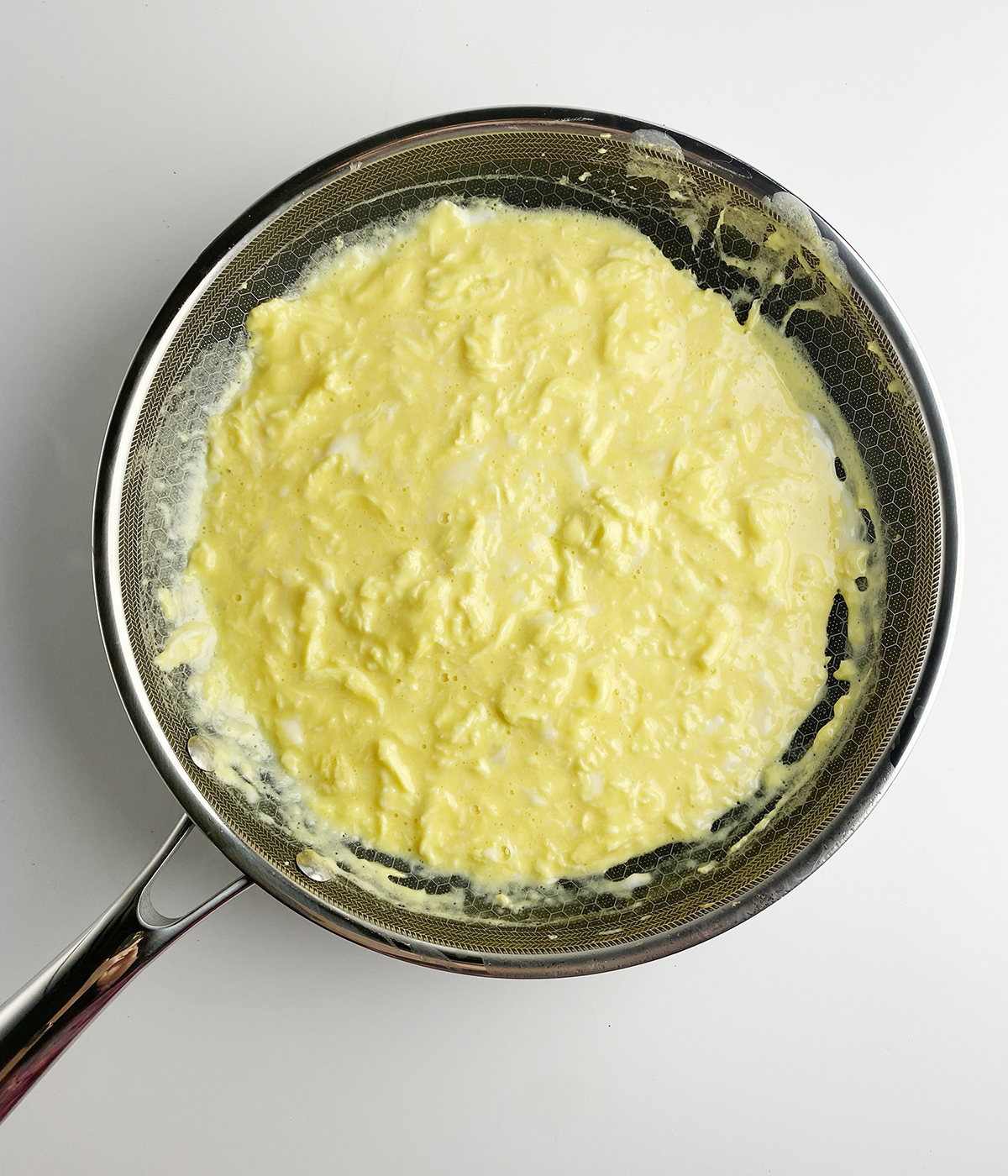 Scrambled eggs in a pan.