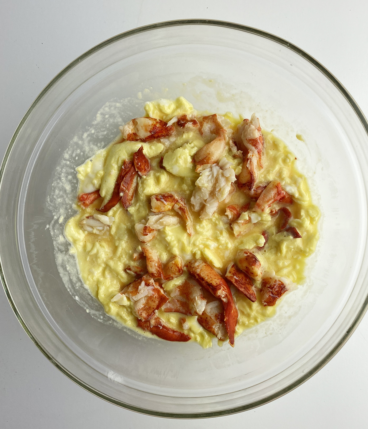 Scrambled eggs with lobster in a bowl.