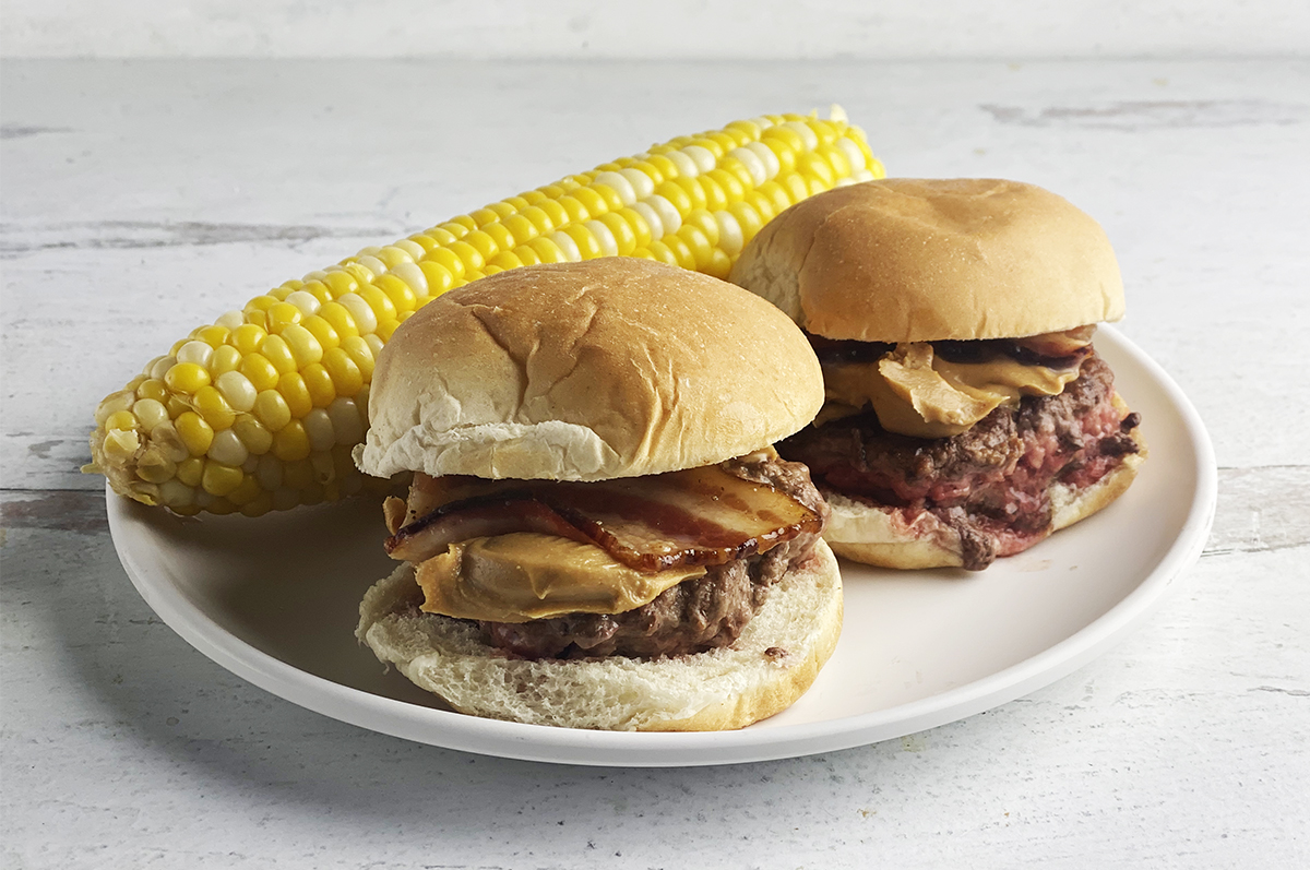 Peanut butter bacon burgers with corn.