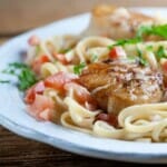 Seared scallops with tomato cream sauce