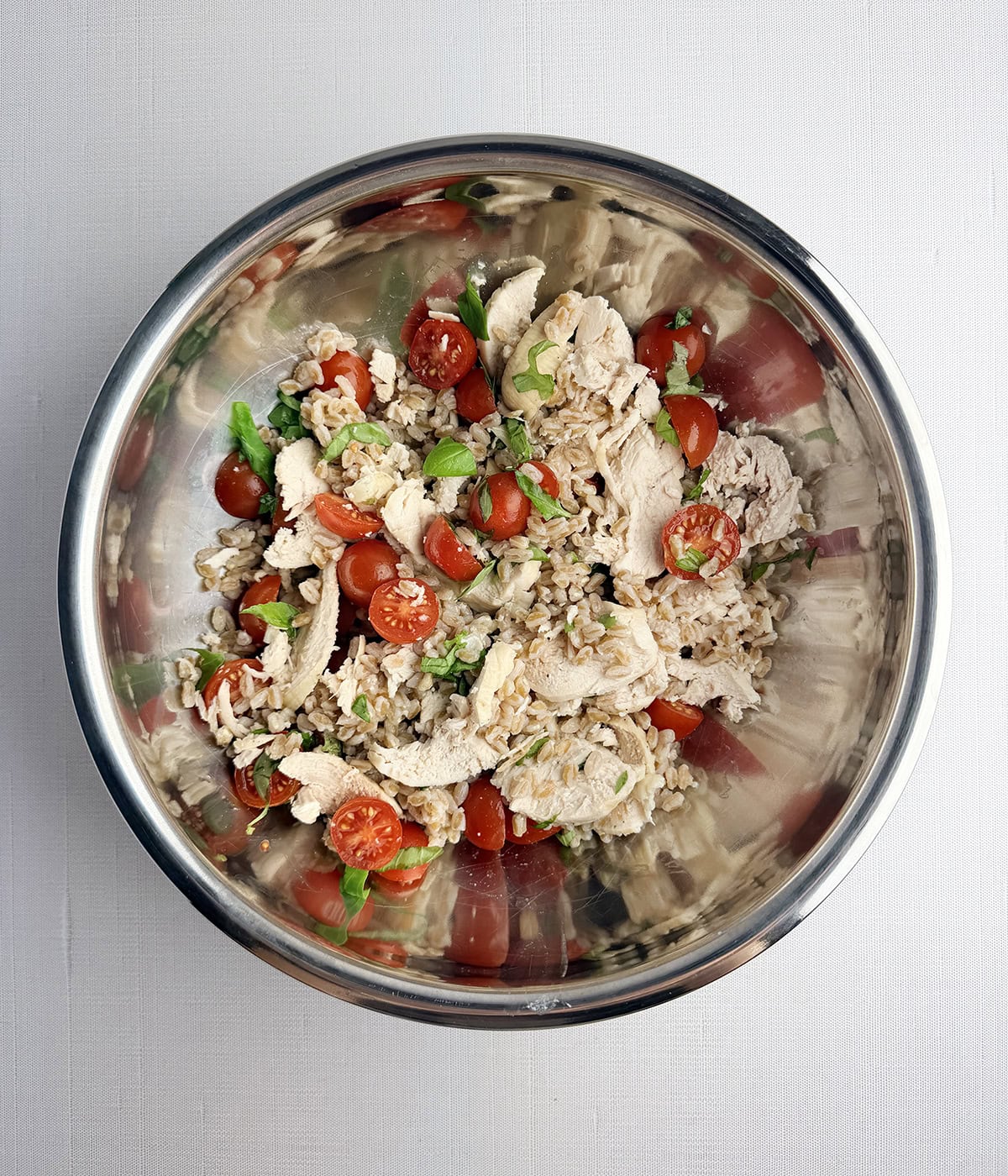 Farro chicken salad in a mixing bowl.