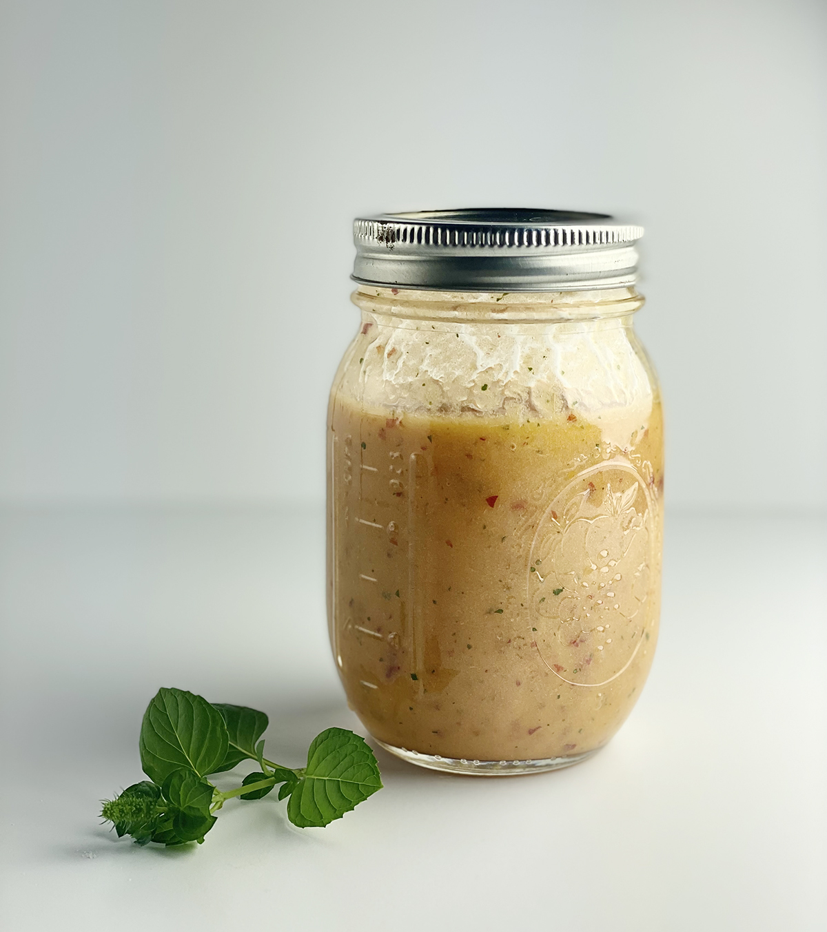 peach margarita mixture in mason jar