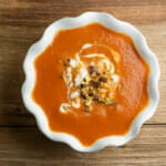 beet soup with swirled goat cheese and pistachios