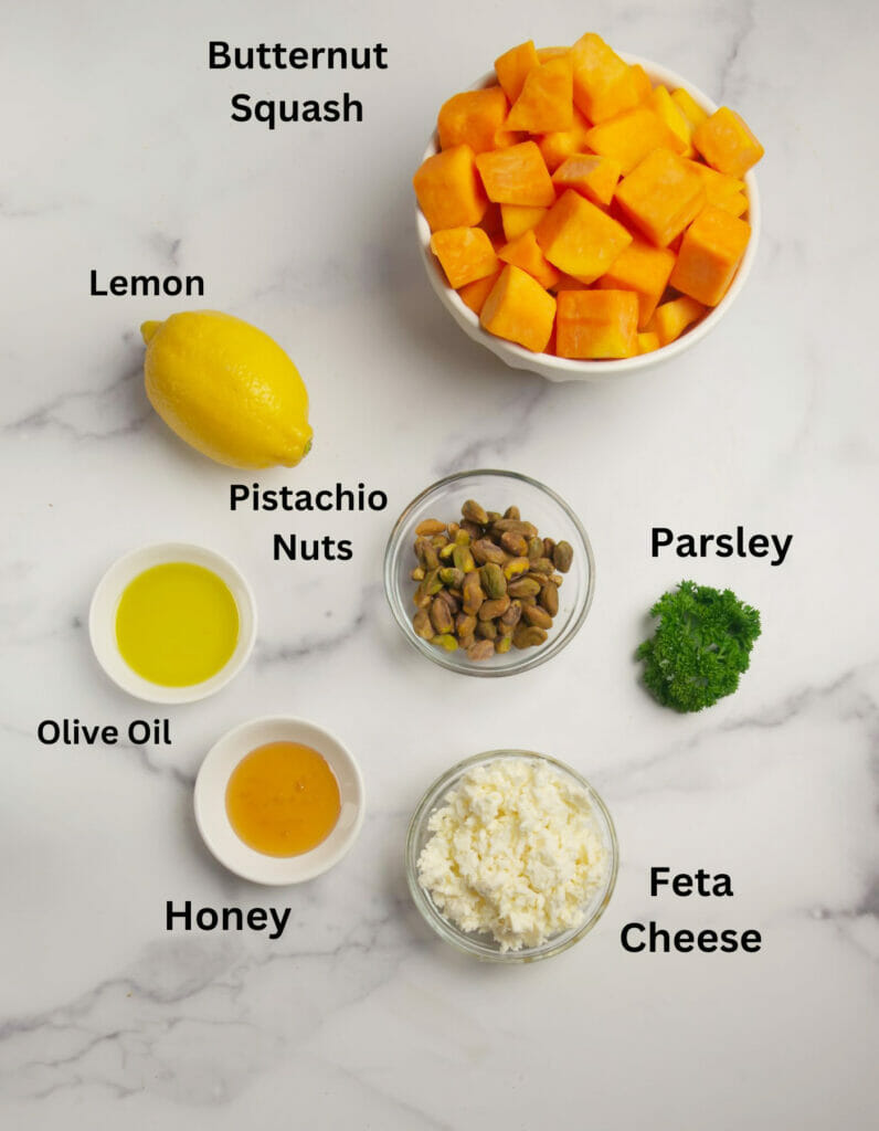 Butternut squash with feta ingredients on a counter.