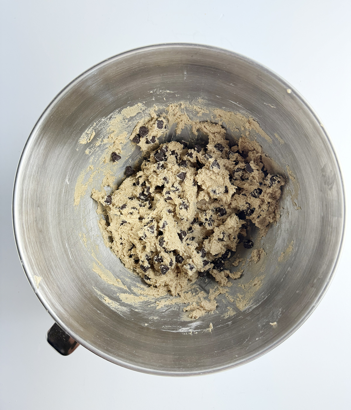 Cinnamon chocolate chip cookie dough in a mixing bowl.