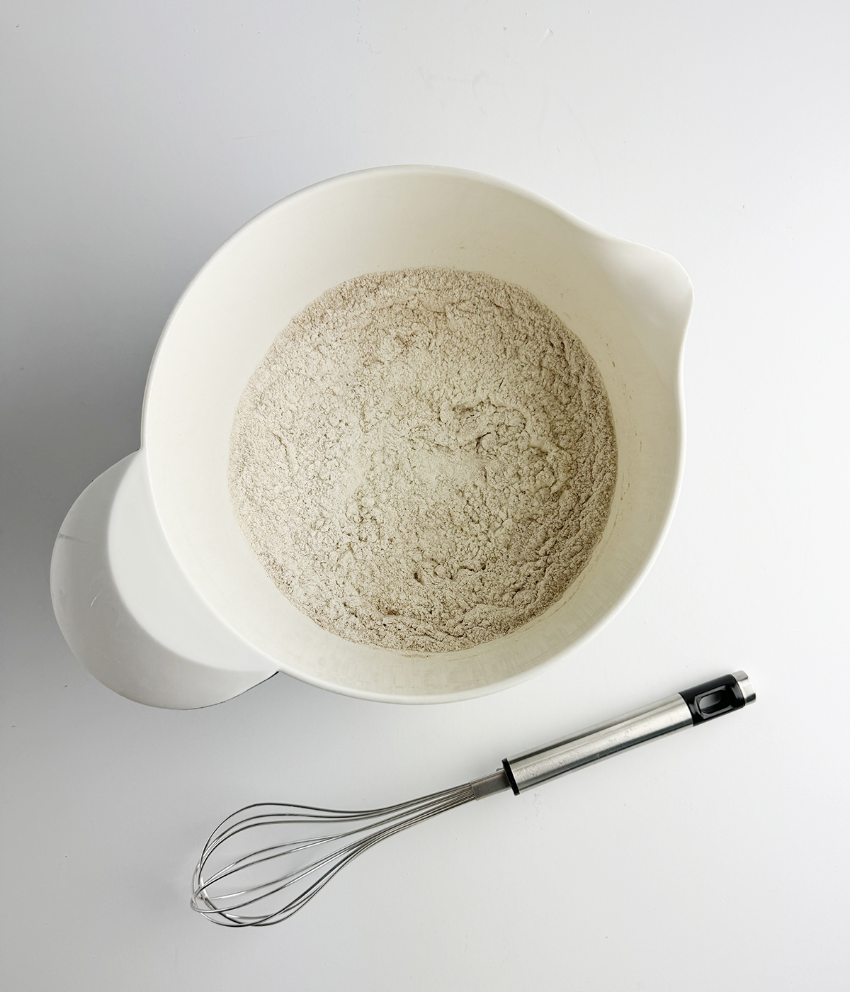 Flour and cinnamon mixture in a bowl.