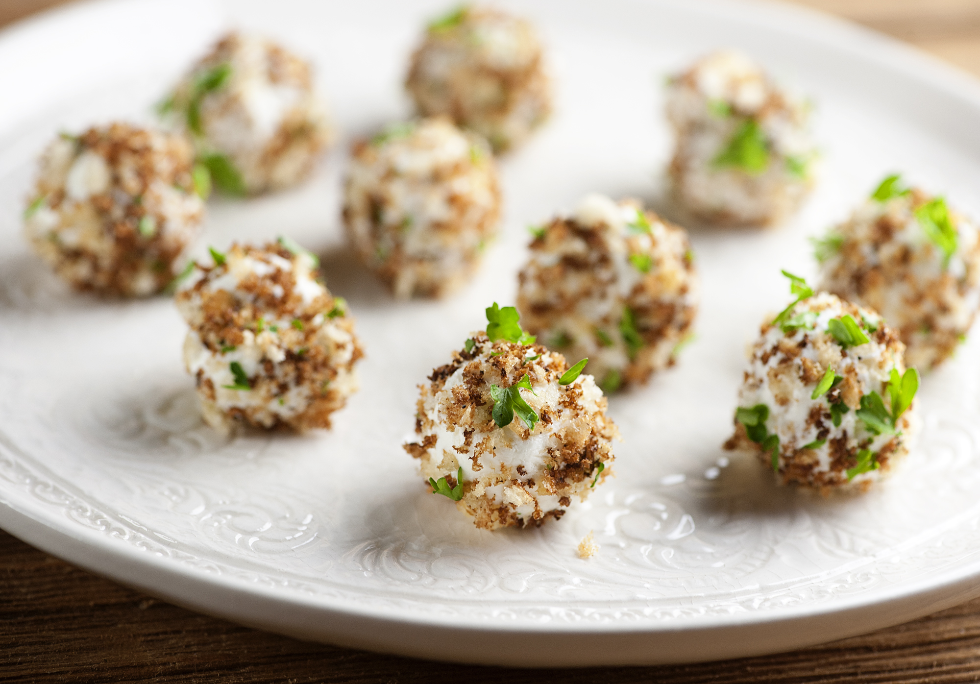 goat cheese truffles Goat cheese truffles on a plate.