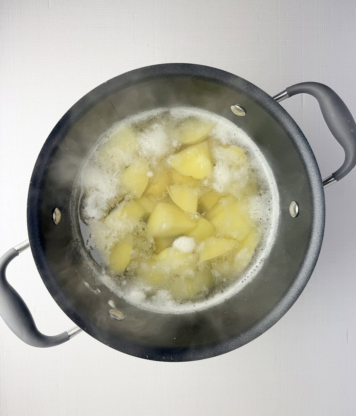Cooked potatoes in a pot.