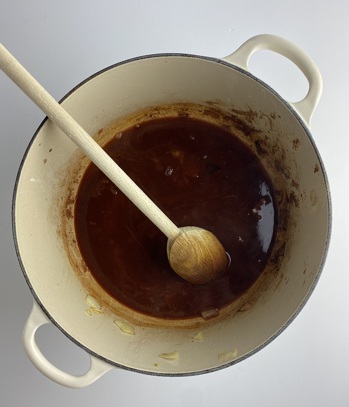 Pot roast sauce in a dutch oven.