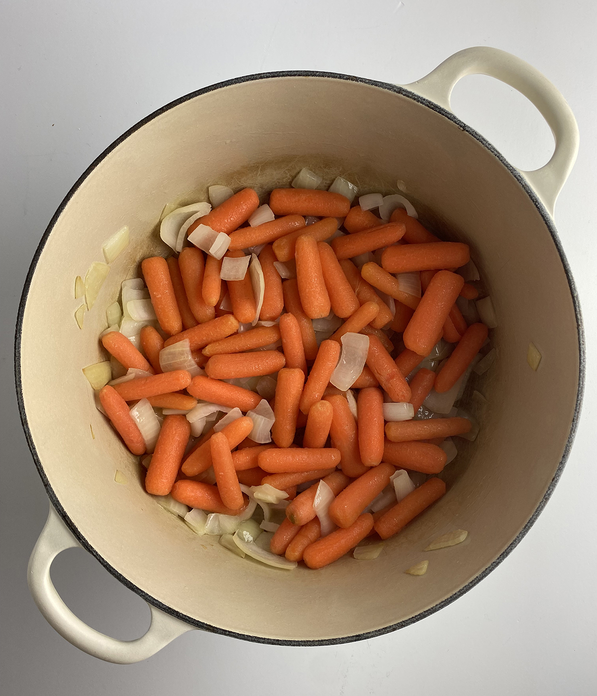 Pot roast veggies in a Dutch Oven.