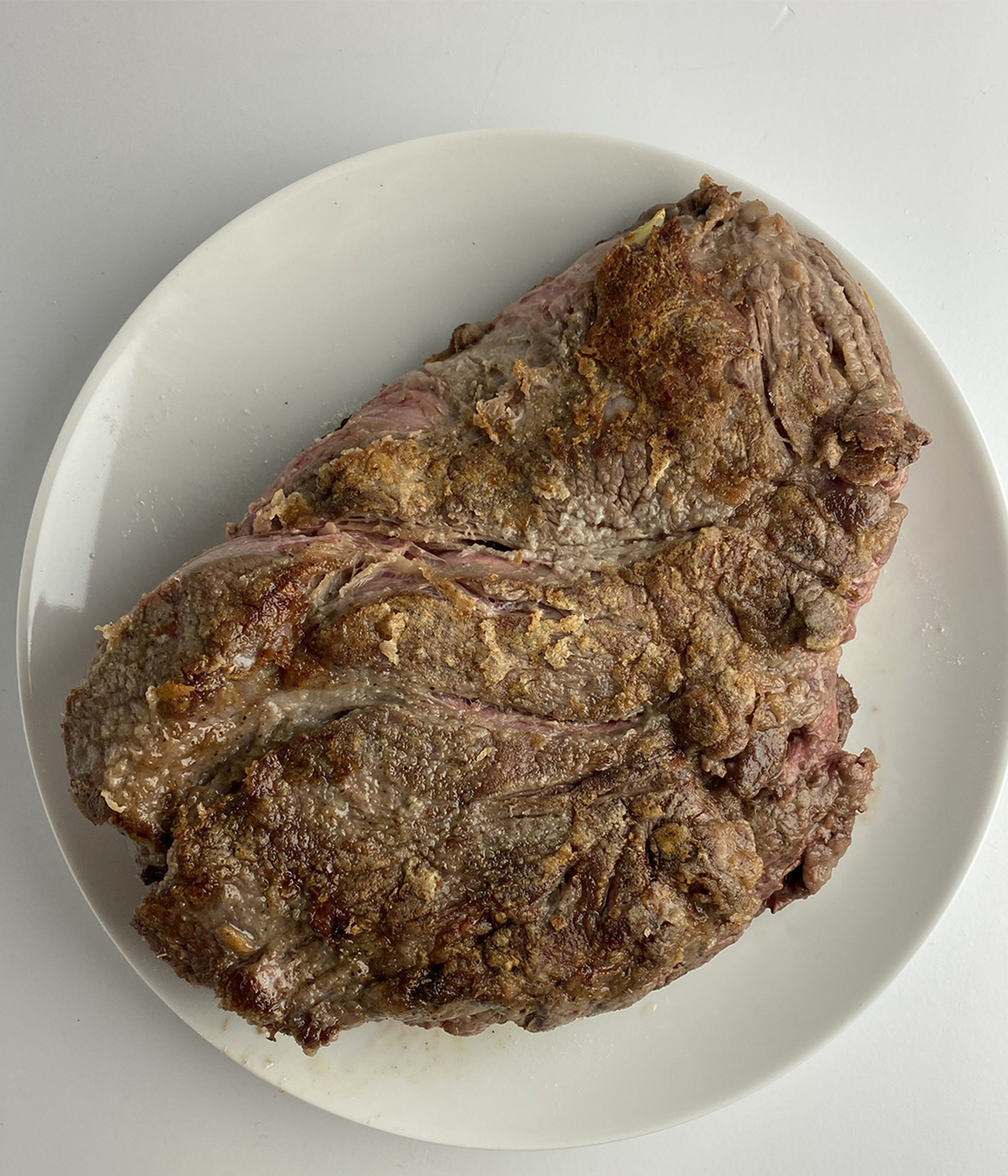 Seared chuck roast on a plate.