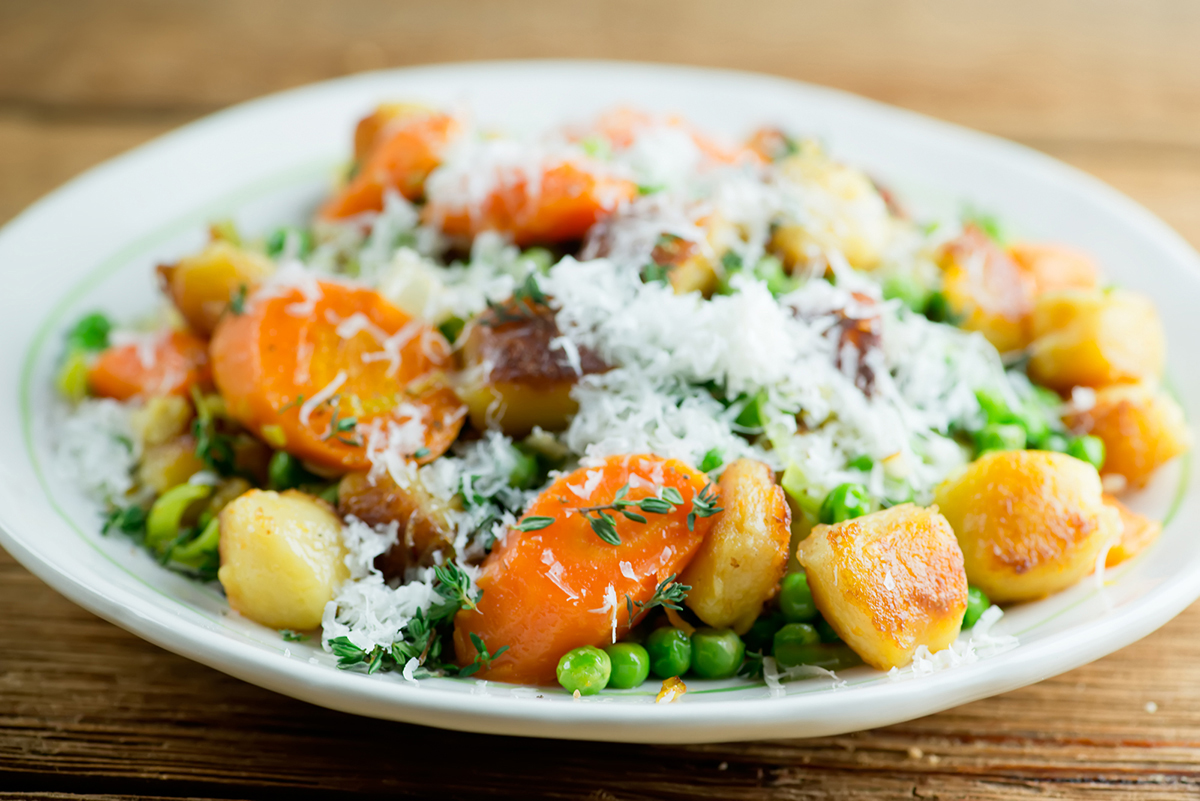 Gnocchi with spring vegetables on a plate.