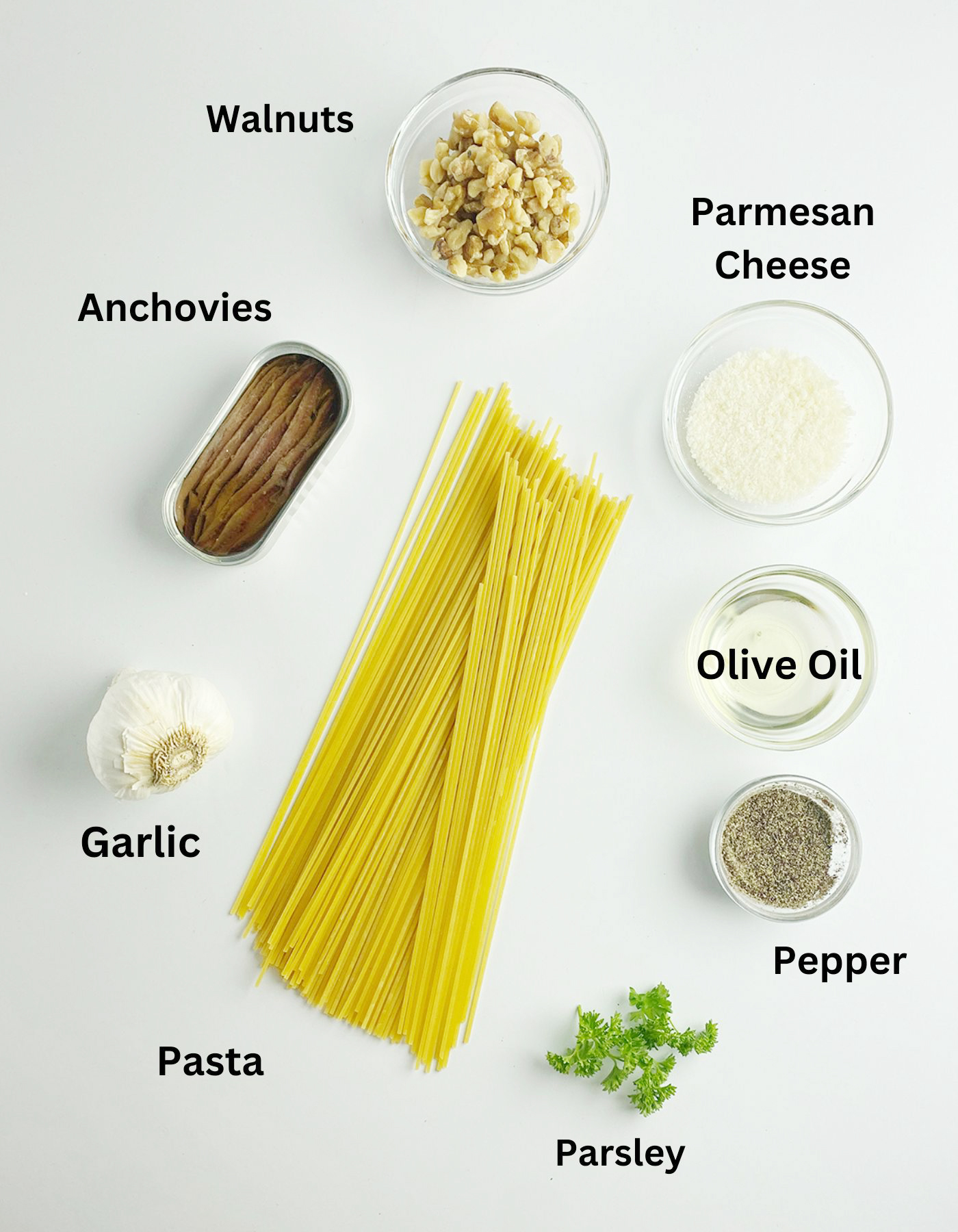 Ingredients needed to make pasta with anchovy sauce.