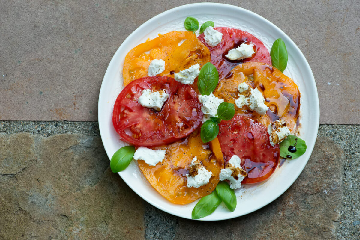 Tomato Goat Cheese Salad on a plate.
